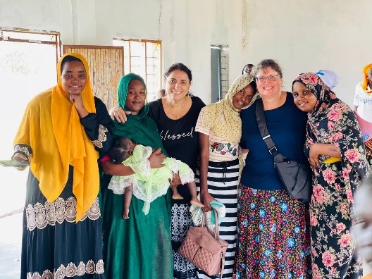 A group of women posing for a photo