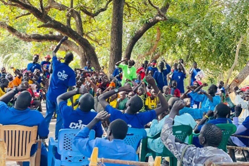 A group of people in blue shirts