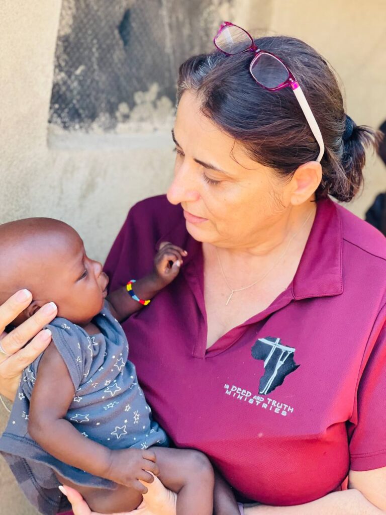 A person holding a baby