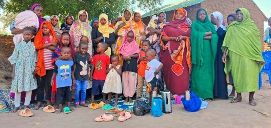 Refuges standing with their possessions.